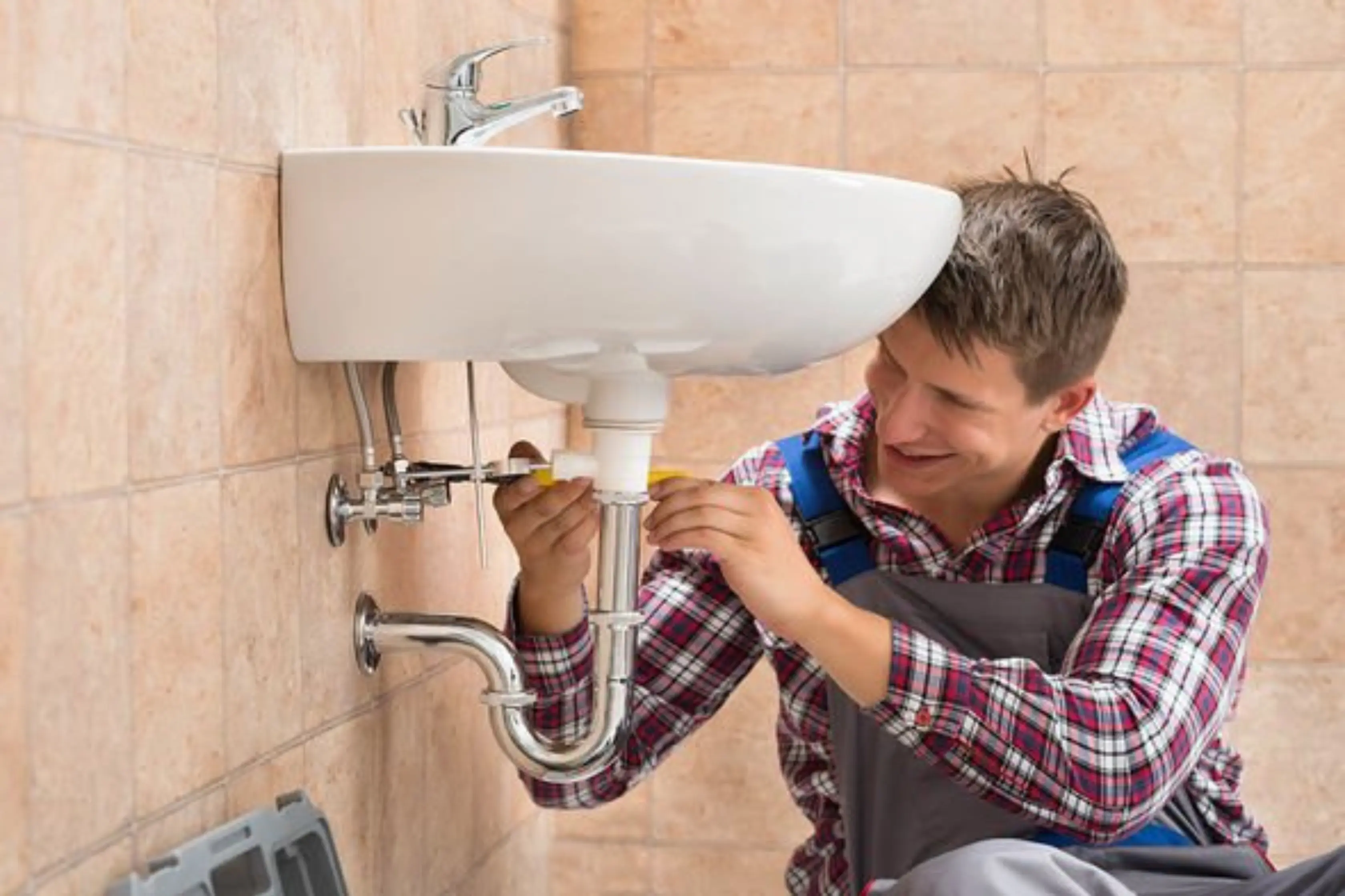 Homeowner Testing U-Bend On Sink